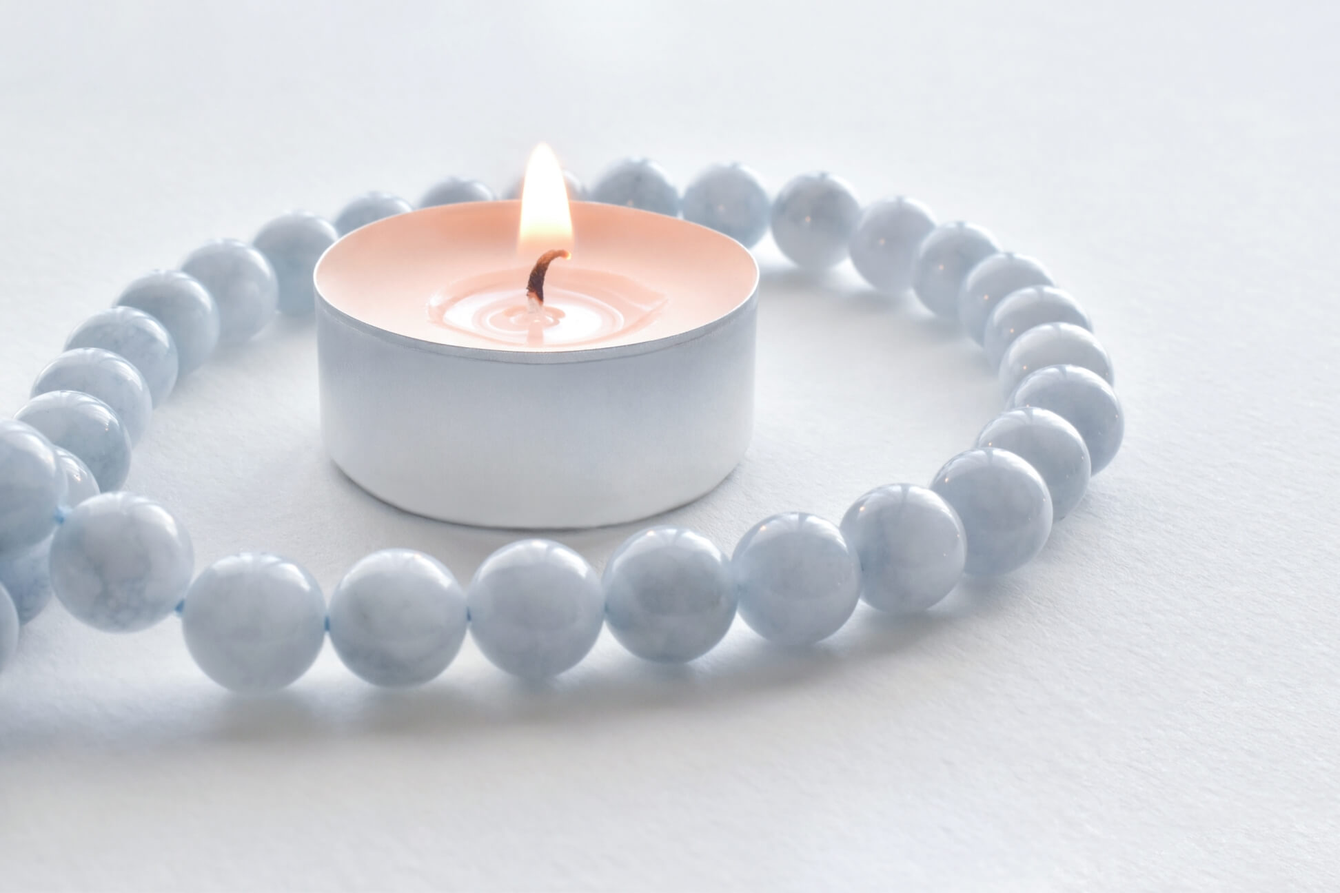 tealight candles with aquamarine necklace around i 2022 11 09 16 09 35 utc